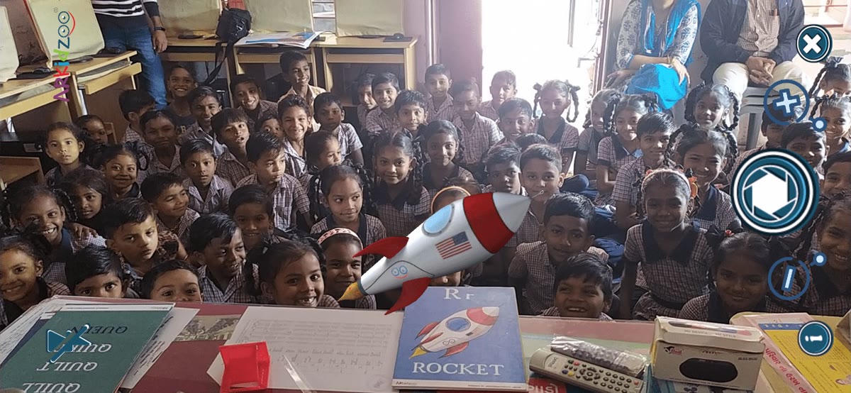A 3D rocket rising above a ROCKET flashcard in a classroom