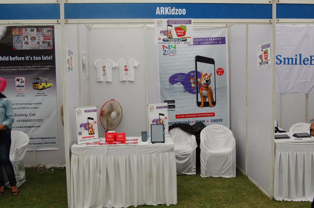 The branded ARKidzoo expo stall with Dropiz AR banners and products